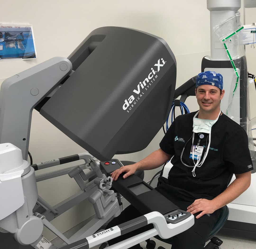 Paul Toomey, MD at the robotic surgery console